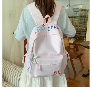Zaino rosa con motivo di stelle per il commuting quotidiano e stile da ragazza dolce.