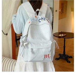 Zaino casual bianco con motivo a stelle, ricamo colorato e design elegante da borsa scolastica.