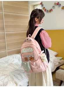 Sac à dos rose style mignon pour filles, cartable d'étudiant décontracté avec poches.