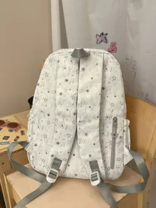 Casual star pattern backpack for students, stylish lightweight canvas book bag for daily travel.