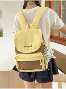 Backpack detail view showing the front flap, transparent pocket and star pendant design.