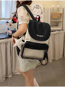 Sac à dos collège bicolore en toile avec poche avant transparente et pendentif étoile pour l'usage.