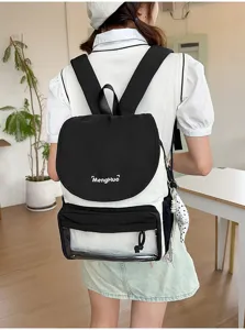Detail view of a black and white college style backpack, showcasing the cute flap and transparent pocket.