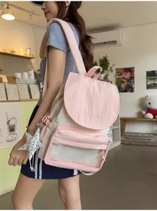 Sac à dos style collège rose et beige avec poche avant transparente, style kawaii.
