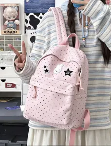 Pink polka dot school backpack detail, cute rabbit patch and star embroidery design.