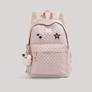 Pink polka dot backpack with cute bunny pendant, sweet Japanese style school bag for daily use.