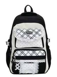 Joli sac à dos noir et blanc de style japonais avec carreaux, pois et charmantes finitions en dentelle.