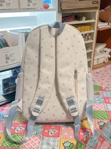 Cute star pattern backpack for daily use, soft aesthetic school bag with back zipper and straps.