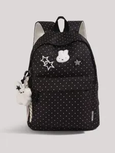 Black polka dot school backpack with cute rabbit patch and plush keychain for daily use.