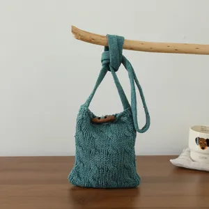 Sac bandoulière en tricot torsadé bleu-vert rétro avec bouton en corne mini sac téléphone élégant