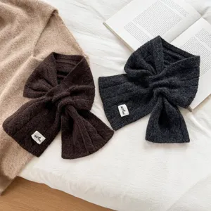 Cozy wool-blend cable knit cross scarf for women, soft solid color winter neck warmer.