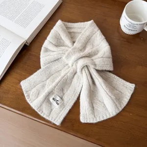 Korean style warm cable knit cross scarf, soft solid color winter neck warmer detail.