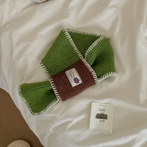 Cozy knit scarf featuring colorblock green and brown design with white trim for women winter warm style.