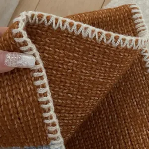 Autumn winter wool blend contrast color knitted scarf detail close up warm neck warmer