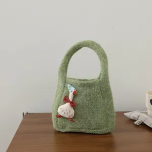 Green knit handbag with cute duck plush decor, stylish mini tote bag for women and kids accessory.