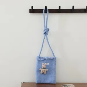 Sac bandoulière en tricot bleu avec pendentif lapin mignon pour rangement de téléphone.