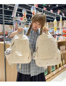 Sac à dos en toile décontracté mignon pour étudiants, avec imprimés d'étoiles colorées et pendentif ours.