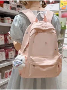 Beau sac à dos rose avec broderie d'étoiles, cartable doux pour fille pour les loisirs quotidiens.