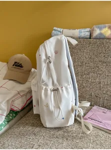 Sac à dos décontracté blanc pour étudiant avec broderie d'étoiles mignonnes pour un usage quotidien.