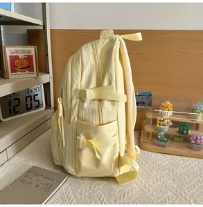 Detailed side view of a stylish yellow and white checkered casual student school backpack.