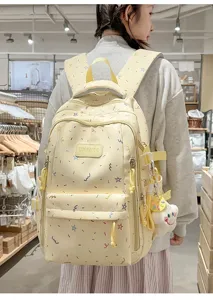 Cute casual canvas school backpack with colorful star pattern for daily travel and students.