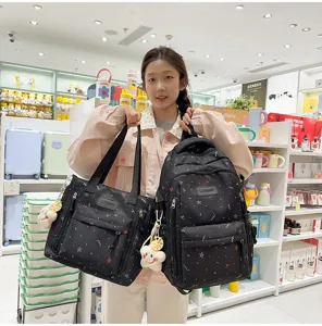 Black student backpack and tote bag set with colorful star pattern, casual school bookbag.