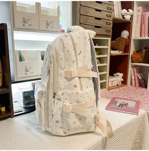 Casual white backpack with colorful star print, perfect for daily school and travel use.