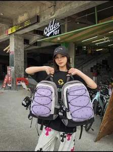 Japanese functional outdoor sports backpack with contrast color and bungee cord design for travel.