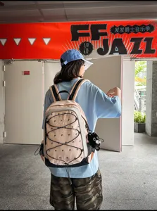 Detail shot of grey blue colorblock tactical outdoor hiking backpack for daily use.