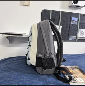 Detail view of Japanese style colorblock functional backpack with mesh side pockets.
