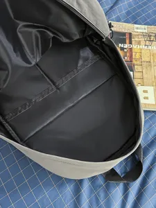 Minimalist gray functional backpack with spacious interior compartment and sturdy straps.