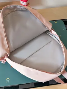 Zaino rosa carino da ragazza per scuola e viaggi, stile pesca dolce, vista principale.