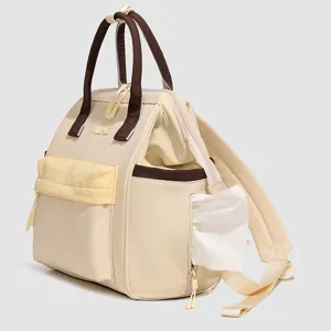 Sac à dos à langer à compartiments multiples pour mamans, léger et pratique en voyage.