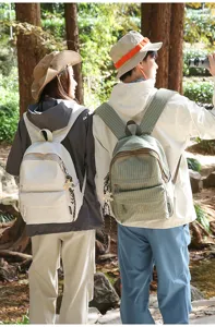 Casual outdoor canvas backpack for students, stylish lightweight waterproof school daypack.