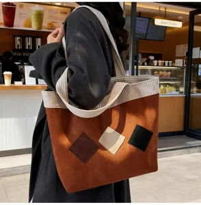Detail shot of retro corduroy patchwork large capacity tote shoulder bag for women.