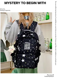 Detailed view of black star print backpack worn by model, showcasing casual daily style.
