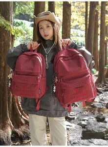 Minimalist red plaid school backpack for women students, lightweight casual outdoor bag.
