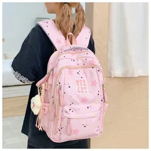 Cute pink star print school backpack with large capacity, ideal for students and daily travel.