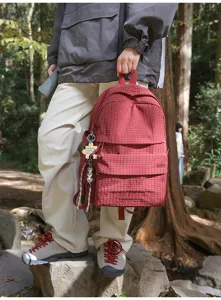 Stylish red plaid backpack for women and students, casual daily outdoor travel book bag.