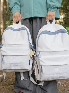 Casual white school backpack for women, stylish minimalist travel daypack with contrast.