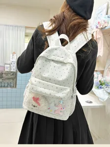 Vue détaillée d'un joli sac à dos à pois de style coréen avec poche avant transparente.