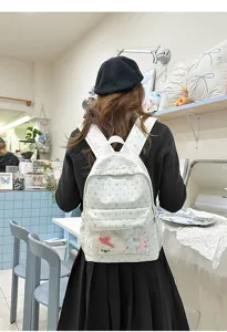 Sac à dos blanc style coréen avec motif étoiles et poche avant transparente pour usage quotidien
