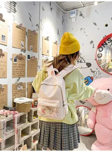 Sac à dos rose à pois avec poche avant transparente, joli cartable décontracté pour filles.