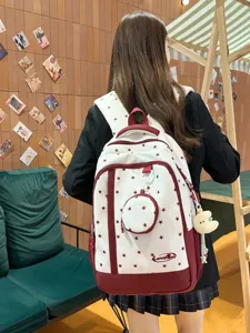 Zaino in tela con stampa di stelle in stile coreano con piccola tasca rotonda e ciondolo.