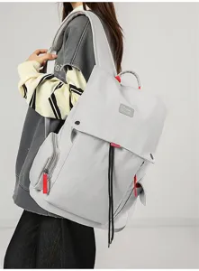Grey large capacity backpack detail view, multi-pocket school bag for daily travel and laptop.