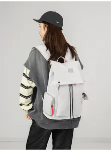 Casual grey canvas backpack for men and women, large capacity travel school book bag.