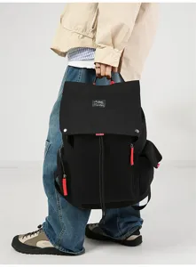 Casual canvas backpack for men and women, large capacity travel school rucksack for students.