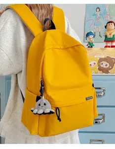Stylish yellow school backpack for students, lightweight casual travel daypack for men and women