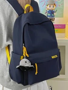 Casual dark blue school backpack with yellow straps and cute octopus pendant for daily student use.