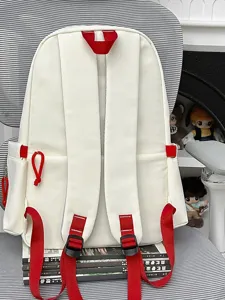 Lightweight school backpack for students, casual daily travel daypack with red straps.